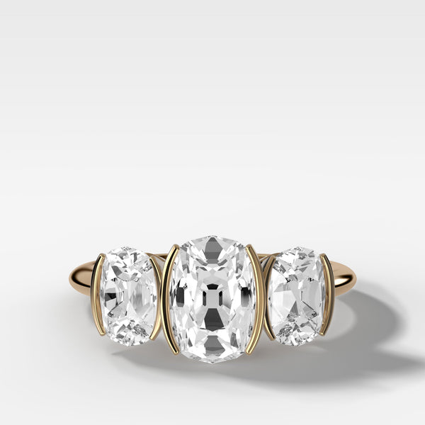 Half Bezel Triad Engagement Ring With Elongated Old Mine Cut Diamonds