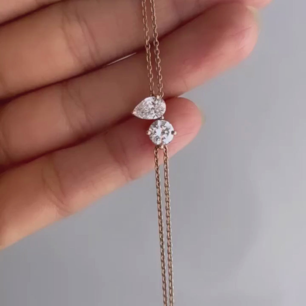 pear & round cut moissanite diamond two stone bracelet in solid gold